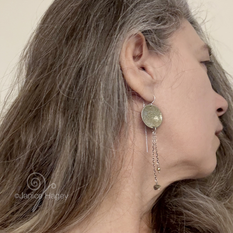 Speckled Sand Asters Enamel Earrings on a model