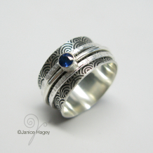 Water Pattern Spinner Ring with 2 Hammered Spinners and Sapphire